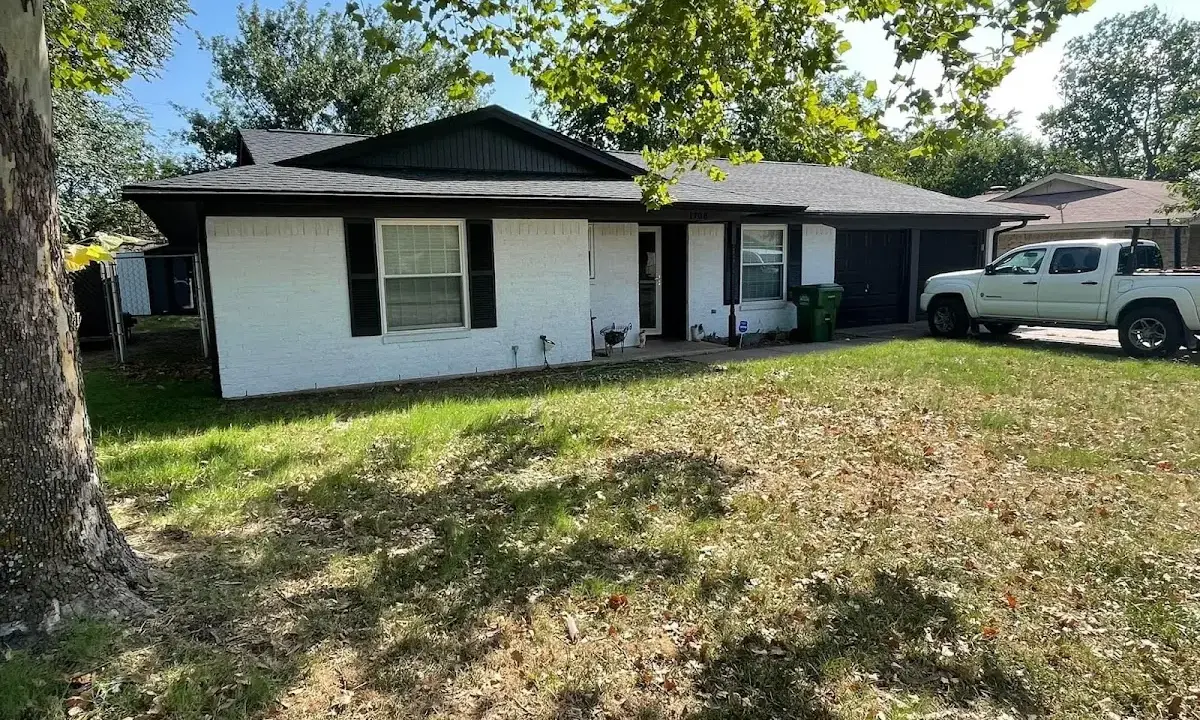 Professional roofing crew working on a residential roof in Deer Park